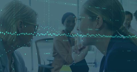 Businesswomen Sharing Secret Amidst Data Flow Visualization