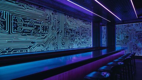 Neon circuit lounge bar with glossy reflective counter, futuristic blue purple lighting