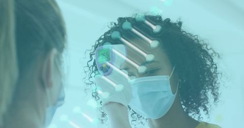 Healthcare worker checking temperature amidst dna structure