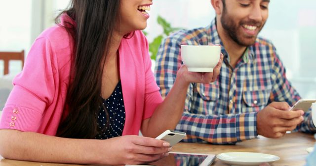 People Enjoying Coffee and Technology at Table - Download Free Stock Images Pikwizard.com