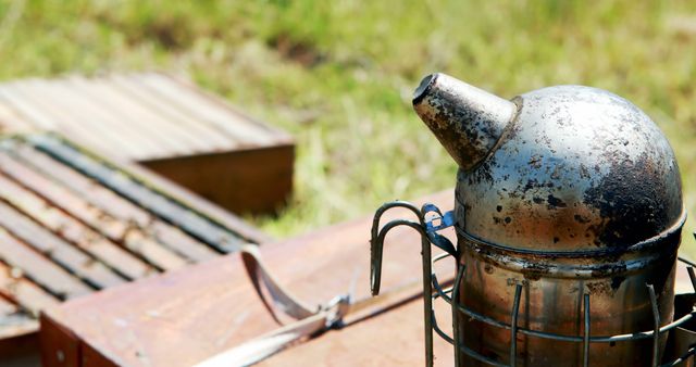 Close-Up of Traditional Beekeeping Smoker Tool in Sunlit Garden - Download Free Stock Images Pikwizard.com