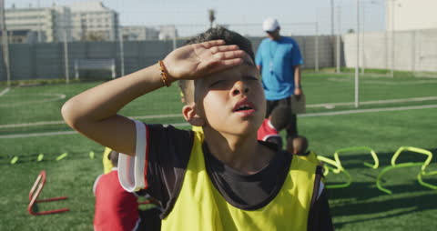 Youth Soccer Player Taking a Break During Training