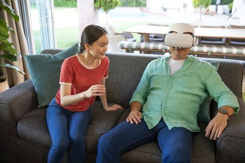 Father and Daughter Exploring Virtual Reality in Home Setting