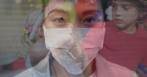 Young Woman in Mask Overlayed with Children's Birthday Celebration