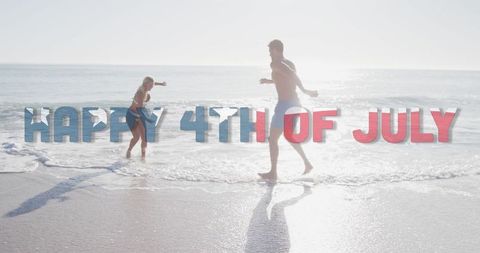 Couple Celebrating 4th of July on Beach with Sea Waves