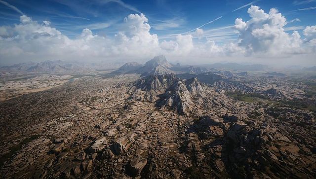 Aerial jagged mountain massif rising from arid rocky plain under dramatic cumulus sky