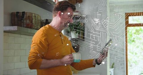 Man holding mug and using smartphone with smart home circuit overlay in bright kitchen