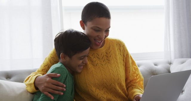 Happy Mother and Son Using Laptop Together on Couch - Download Free Stock Images Pikwizard.com