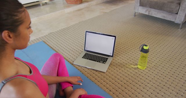 Woman Exercising at Home in Front of Laptop on Exercise Mat - Download Free Stock Images Pikwizard.com