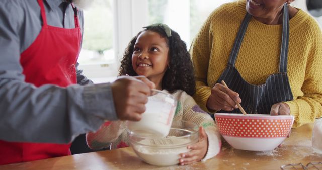 Happy Grandparents Baking with Granddaughter in Kitchen - Download Free Stock Images Pikwizard.com