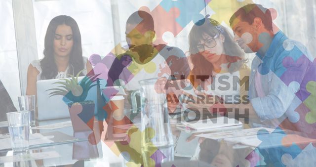 Image of puzzle and autism awareness month text over diverse students working. Autism awareness month, celebration and digital interface concept digitally generated image.