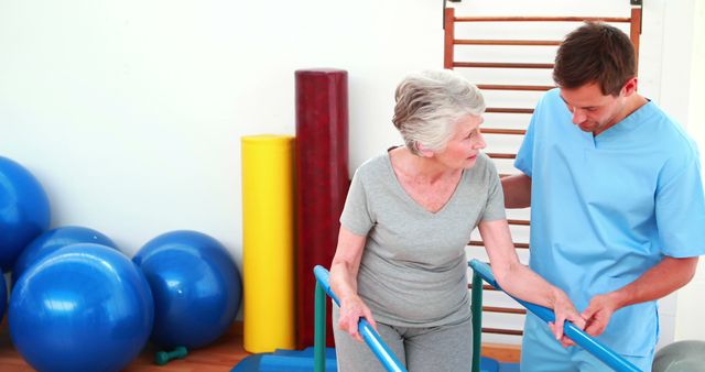 Physiotherapist Assisting Senior Woman with Rehabilitation Exercises - Download Free Stock Images Pikwizard.com