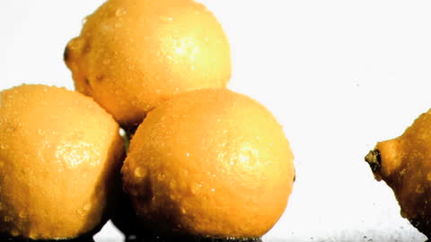 Refreshing Wet Lemons Splashing Background