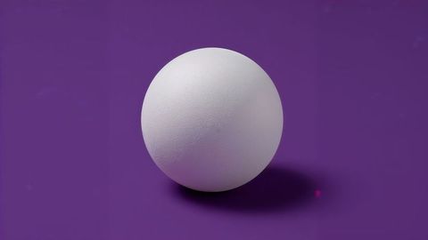 Textured White Sphere with Shadow on Vibrant Purple Background