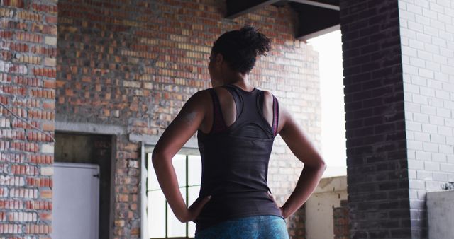 Confident Athlete Prepares for Workout in Industrial Gym - Download Free Stock Images Pikwizard.com