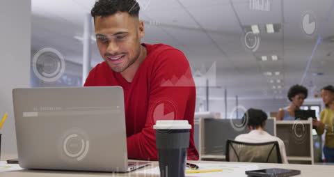 Tech-Savvy Professional Analyzing Financial Data in Modern Office