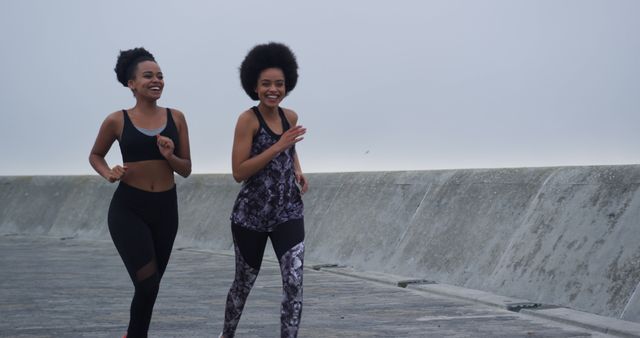 Two Women Jogging on Coastal Path in Activewear - Download Free Stock Images Pikwizard.com