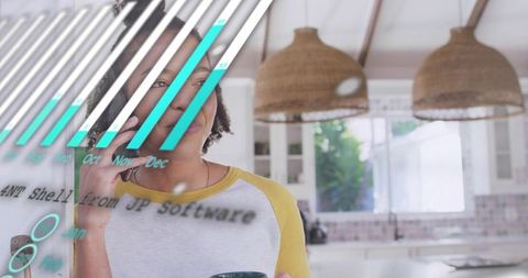 Woman holding coffee on call in bright coastal kitchen with data visualization overlay