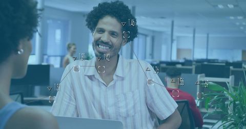 Colleagues Collaborating with Data Processing in Modern Office