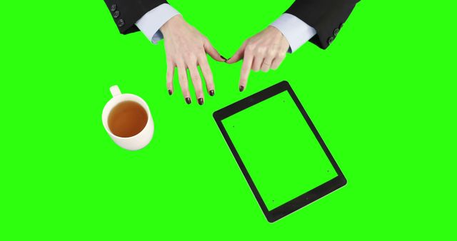 Businessperson Hands Pointing at Tablet with Coffee on Green Screen Background - Download Free Stock Images Pikwizard.com