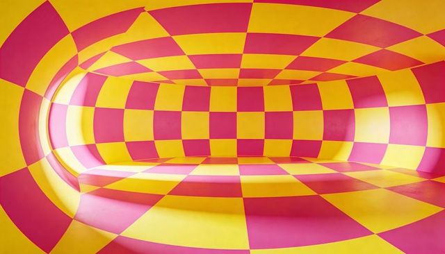 Immersing viewer in pink and yellow checkerboard tunnel with curved bench and arch