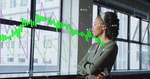 Business professional analyzing financial data trends graphic overlay