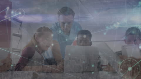 Teacher Assisting Diverse Students in Digital Technology Classroom