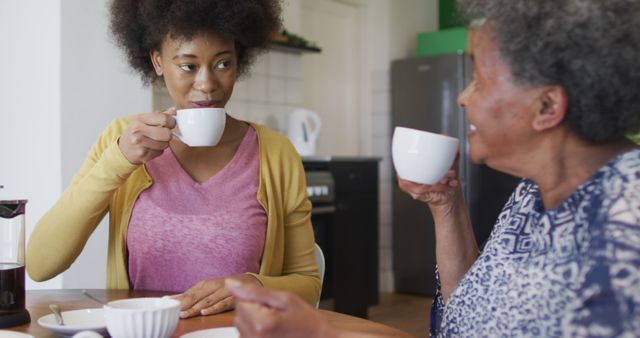 Two Afro-American Women Enjoying Coffee Together at Home - Download Free Stock Photos Pikwizard.com