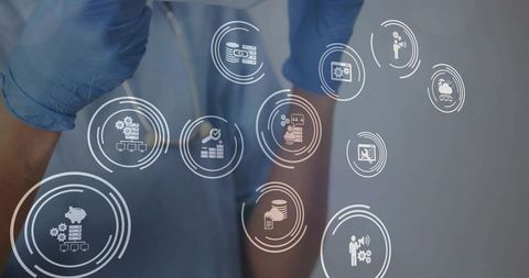 Clinician tapping holographic healthtech icons on glass with stethoscope in view