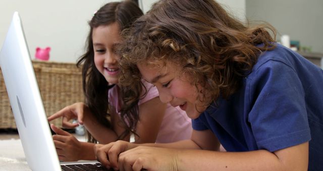 Happy Children Using Laptop Together Indoors - Download Free Stock Photos Pikwizard.com