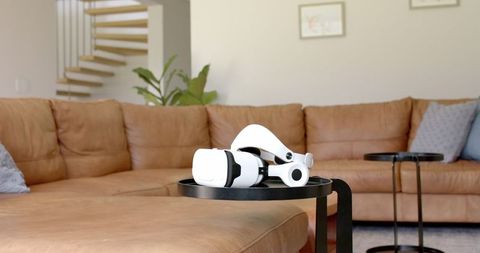 VR Headset on Coffee Table in Modern Living Room Interior