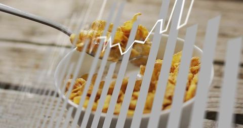 Cornflakes Bowl with Spoon Lifting Flakes and Financial Chart Overlay Conveying Growth