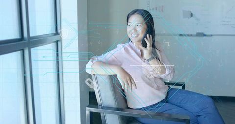 Businesswoman in Office with Futuristic Technology Overlays