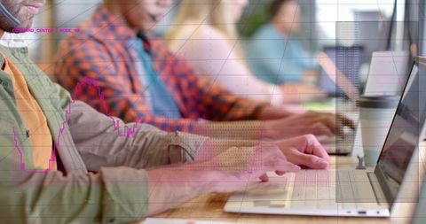 Typing team collaborating on laptops with magenta data overlay, coworking productivity