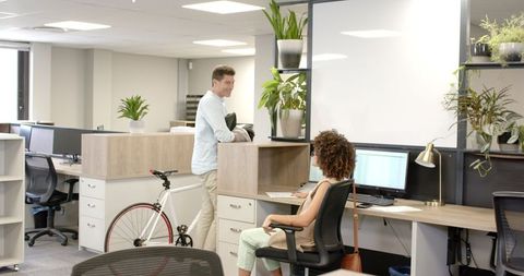 Modern office collaboration with bicycle in creative space