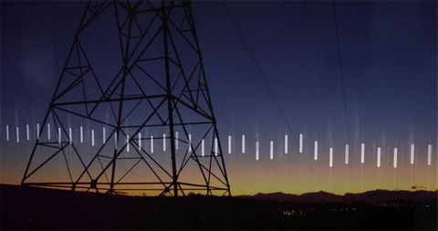 Silhouette Transmission Tower Against Colorful Dusk Sky