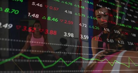 Training woman reflecting in gym mirror overlaying stock market charts for data-driven fitness