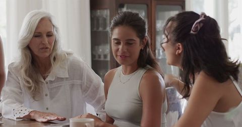 Women Discussing Wedding Plans in Relaxed Home Setting