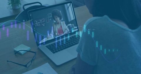 Businesswoman video conferencing laptop with analytics graphics