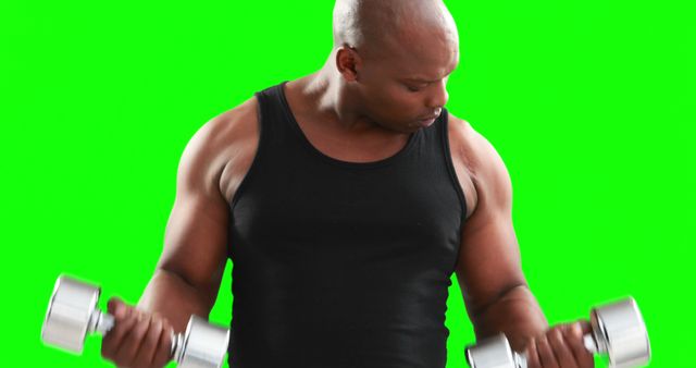 Fitness Enthusiast Exercising with Dumbbells on Green Screen Background - Download Free Stock Images Pikwizard.com