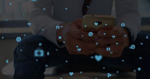 Man using smartphone amidst digital network with icons