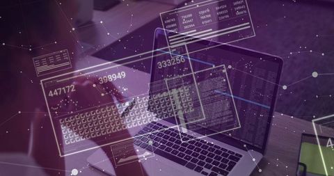 Data Analyst Working on Laptop in Modern Digital Workspace