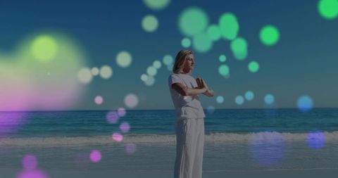 Man meditating on beach with pastel bokeh lights, coastal mindfulness and wellness
