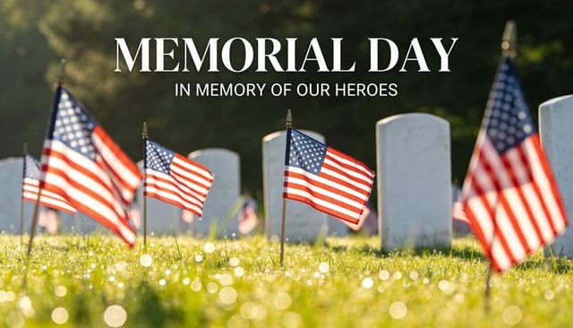 Memorial day flags honoring fallen soldiers in sunlit military cemetery