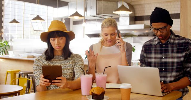 Millennials in Coffee Shop Using Technology and Drinking Smoothies - Download Free Stock Images Pikwizard.com