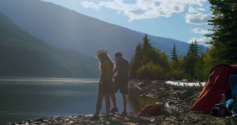 Young Couple Enjoying Serene Lakeside Campsite Retreat - Download Free Stock Images Pikwizard.com