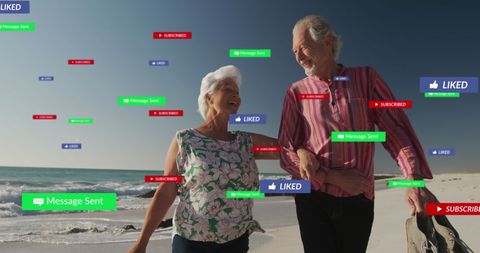 Senior Caucasian Couple Engaging with Social Media on Sandy Beach - Download Free Stock Images Pikwizard.com
