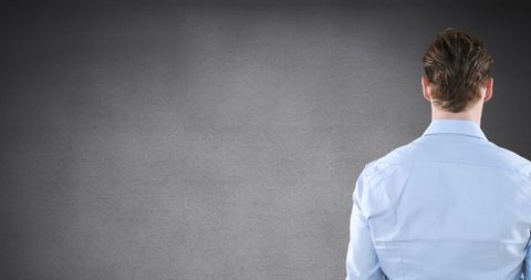 Businessman Interacts with Digital Interface on Grey Background - Download Free Stock Images Pikwizard.com