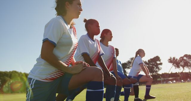 Female Soccer Players Warming Up on Pitch at Sunset - Download Free Stock Images Pikwizard.com