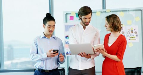 Diverse Business Team Collaborating with Technology in Bright Office - Download Free Stock Images Pikwizard.com